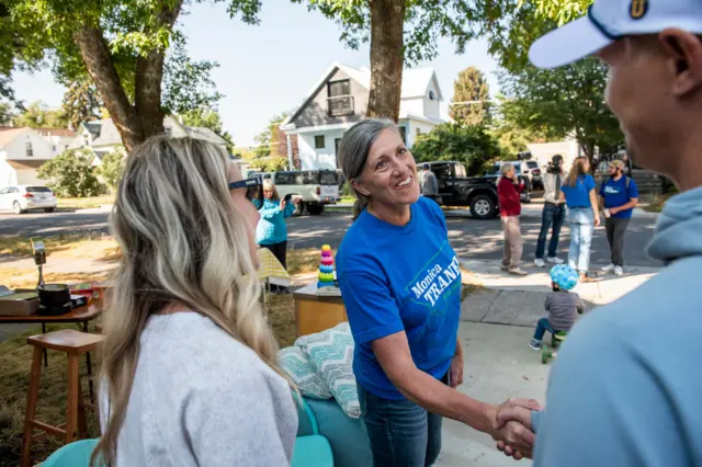 Tranel shaking hands on the campaign trial