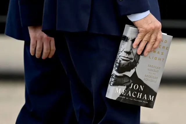 Biden was carrying a biography of Lincoln as he boarded Air Force One