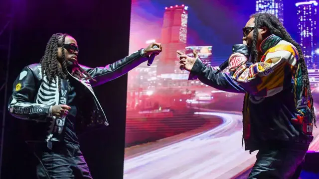 Quavo and TakeOff on stage.