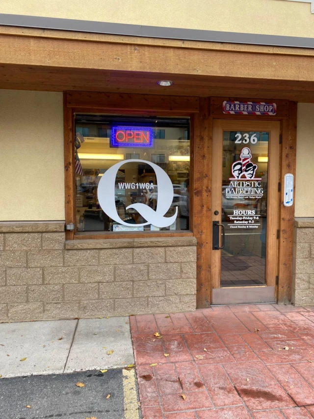 The letter 'Q' displayed prominently outside the barbershop in Montana