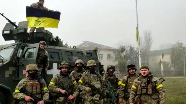 Soldiers of the forces of the 131st separate reconnaissance battalion celebrate recapturing the city of Snihurivka, Mykolaiv Region, Ukraine November 10, 2022 i