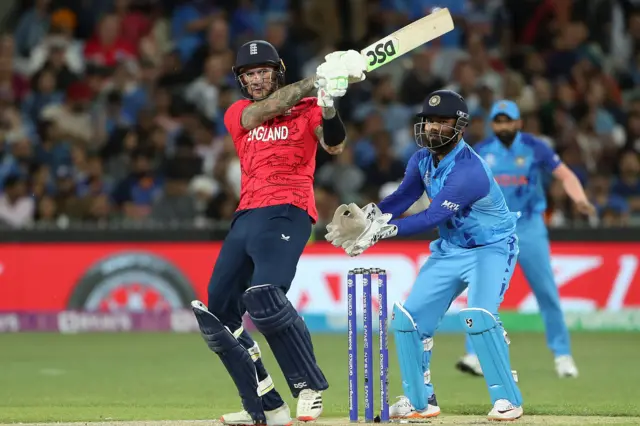 Alex Hales playing a pull shot as India wicketkeeper Rishabh Pant watches