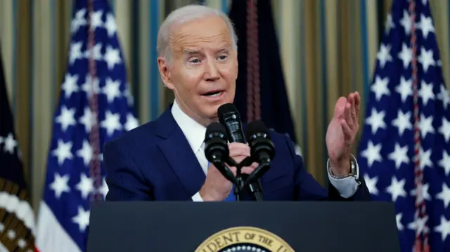 Biden answers questions during a White House news conference last night