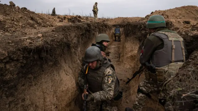 Ukrainian soldiers from the 63 brigade are seen having military training simulating an attack in the trenches for the counteroffensive to recapture Kherson.