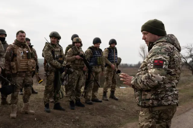 A commander from the 63 brigades is seen giving a debriefing after military training simulating an attack in the trenches for the counteroffensive to recapture Kherson