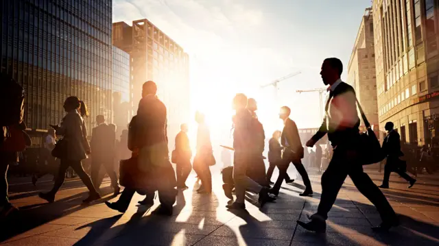 People crossing road in sunrise