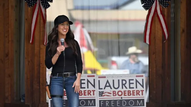 Lauren Boebert pictured on the campaign trail with a gun holstered to her thigh