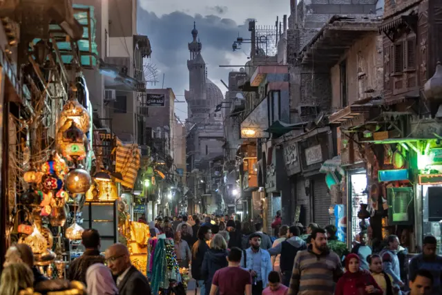 Crowds in a very popular street, in Cairo, during the late afternoon