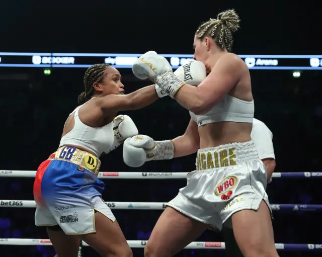 Natasha Jonas throws a punch at Marie-Eve Dicaire