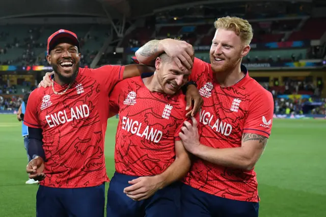 Jos Buttler celebrates with Ben Stokes and Chris Jordan