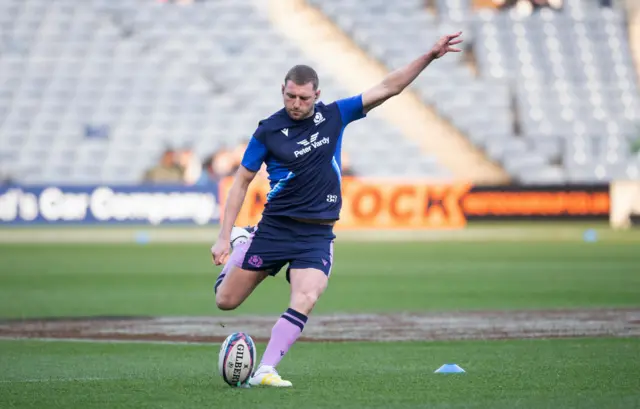 Finn Russell strikes a kick before Scotland face New Zealand at Murrayfield