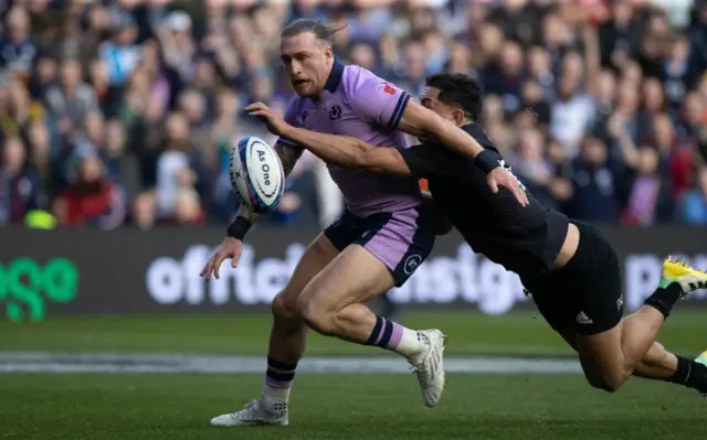 Stuart Hogg is impeded as he gives chase to his own kick