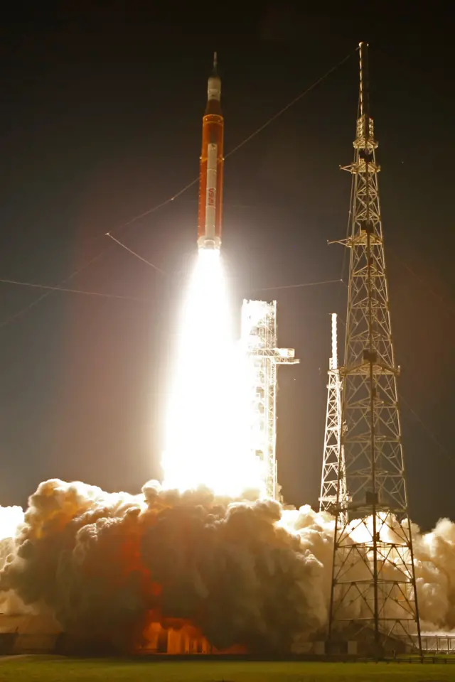 NASA's next-generation moon rocket, the Space Launch System (SLS) rocket with the Orion crew capsule lifts off