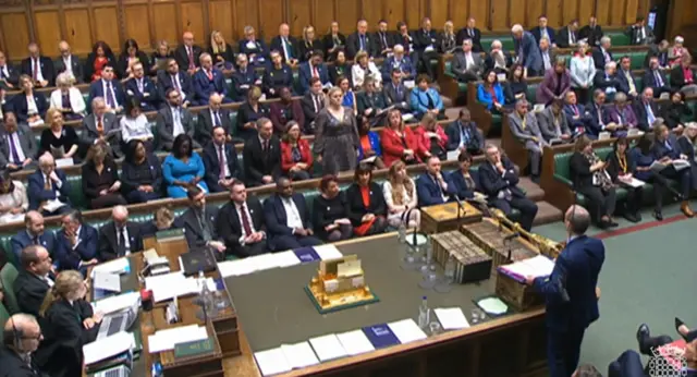 Wide view of MPs in the House of Commons as Dominic Raab takes PMQs