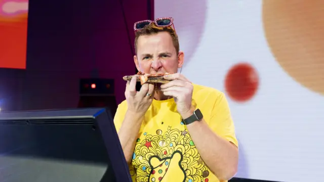 Scott eating pizza