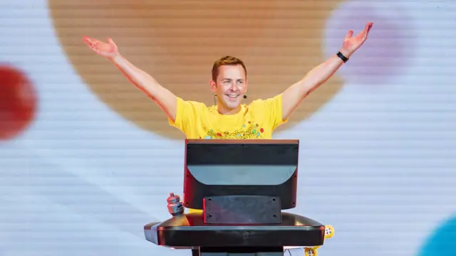 Scott with outstretched arms in celebration