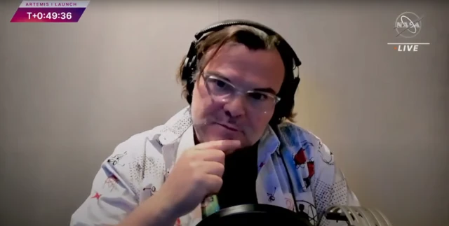 Actor Jack Black poses a question on the Nasa live feed