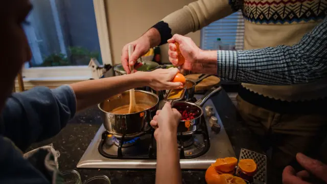 Family making Christmas dinner