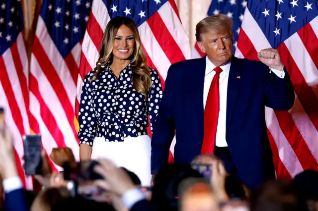 Melania and Donald Trump wave to supporters