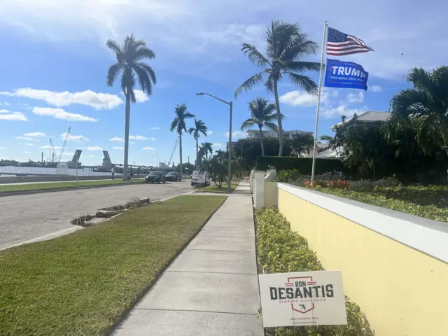 DeSantis and Trump signs