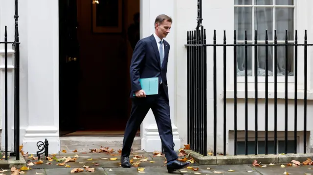 Chancellor Jeremy Hunt leaving Number 11 Downing Street