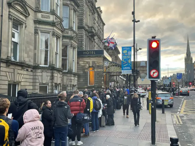 Hundreds of rail passengers queue outside Newcastle train station