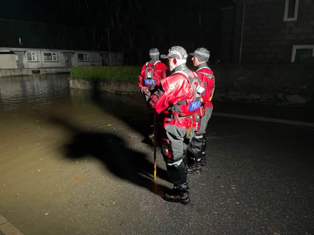 Police officers are going door-to-door