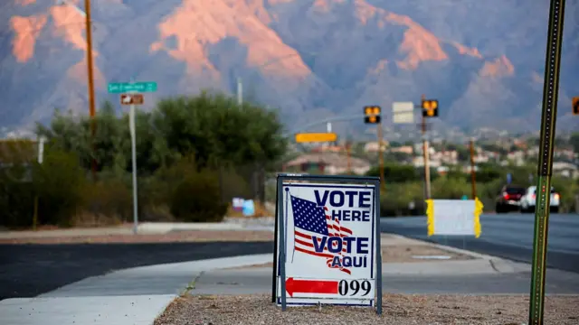 A sign directs voters to a polling station on Election Day in Tucson, Arizona