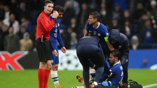 Ben Chilwell receiving medical treatment.