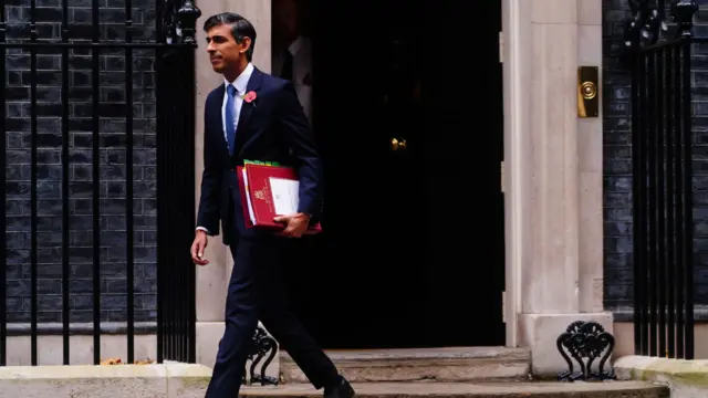 Sunak walks out of Downing Street