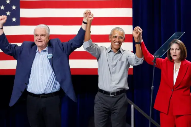 Nevada Governor Steve Sisolak (L), former US President Barack Obama (C) and US Senator Catherine Cortez Masto