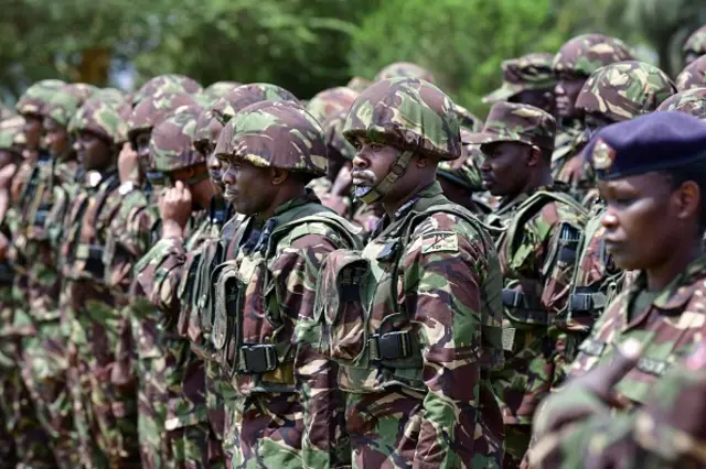 Kenya Defence Forces (KDF) soldiers attend a flag presentation ceremony by Kenya's President William Ruto before they deploy to the Democratic Republic of Congo (DRC) as part of the East Africa Community Regional Force (EARDC) at the Embakasi Garrison in Nairobi on November 2, 2022