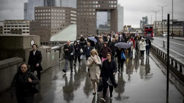 People walking in the rain