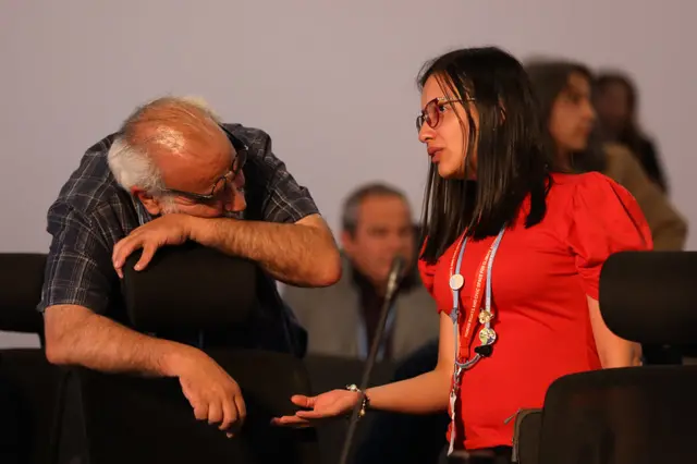 Delegate rests on a chair