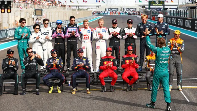 F1 drivers clapping Sebastian Vettel