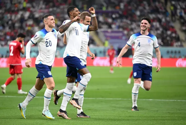 Marcus Rashford celebrates with Phil Foden, Harry Kane and Declan Rice