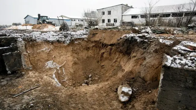 A view of the destruction at the scene of a blast site at a grain drying facility in Przewodow, Poland