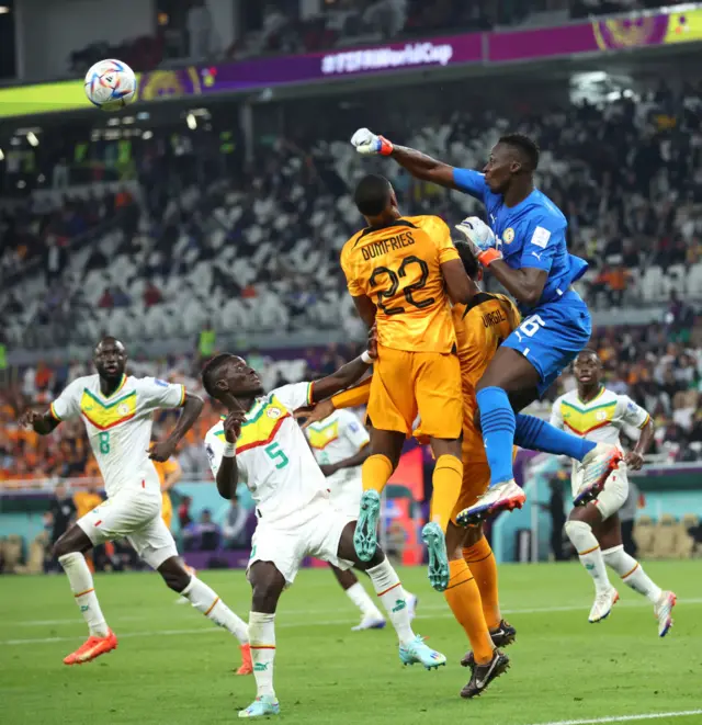 Edouard Mendy punches a corner clear