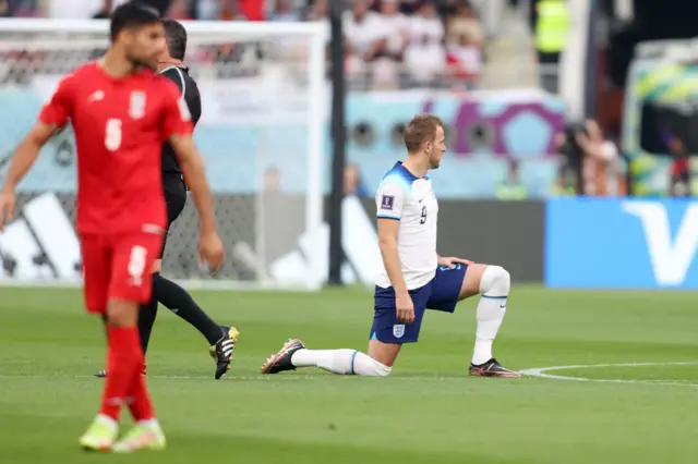 Harry Kane takes the knee for England