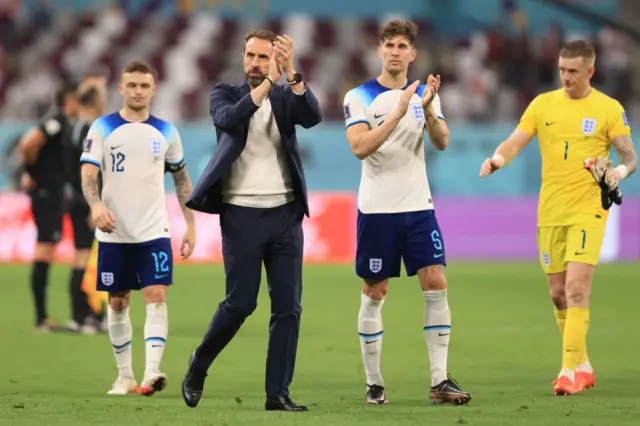 Gareth Southgate and John Stones applaud the England fans