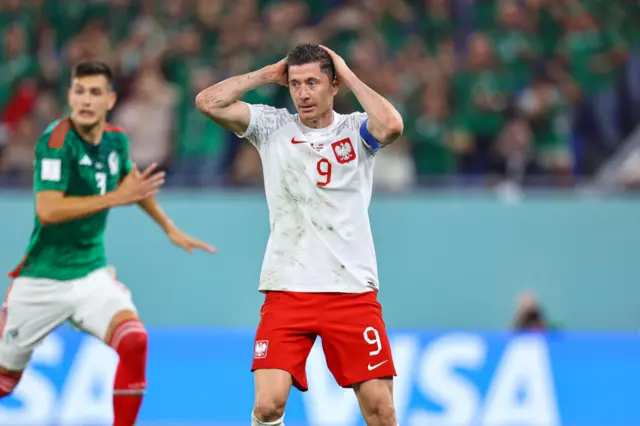 Robert Lewandowski reacts to his saved penalty