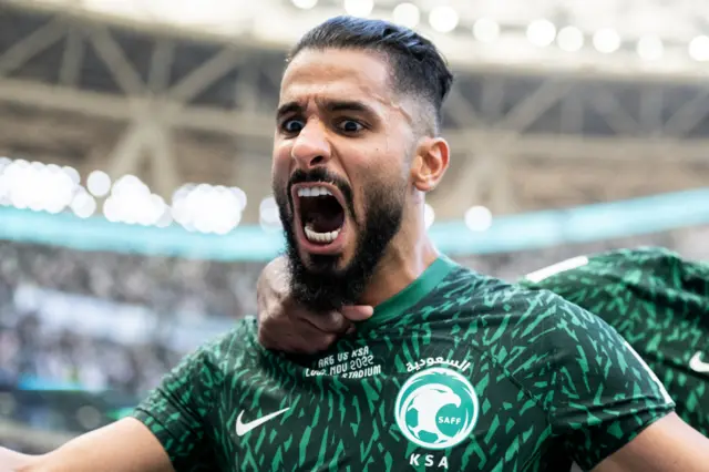 Saleh Al-Shehri of Saudi Arabia celebrates