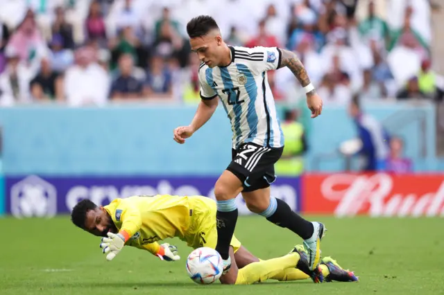 Lautaro Martinez of Argentina runs beyond Mohammed Al-Owais of Saudi Arabia before score a goal that is disallowed for offside