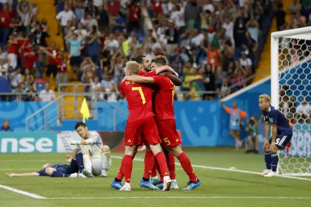 Belgium celebrate their late winner against Japan in 2018