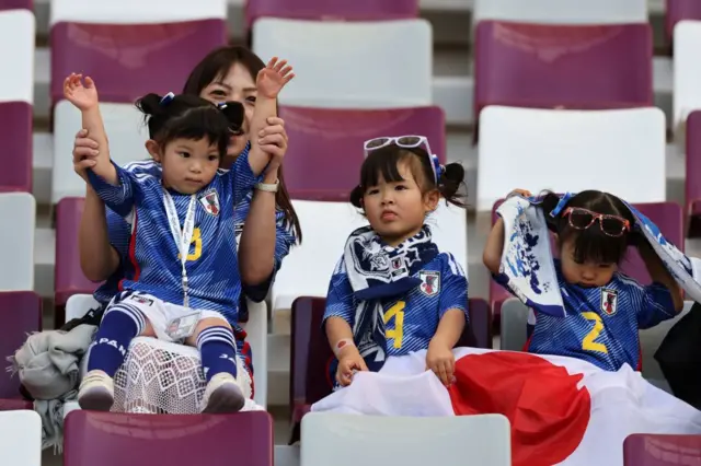 Three young Japan fans at the match