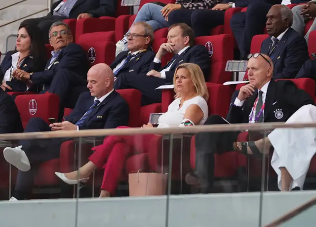 Nancy Faeser wearing the OneLove armband sat next to Fifa president Gianni Infantino