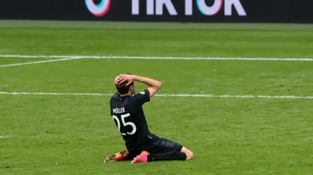 Thomas Muller on his knee after his miss against England at Euro 2020