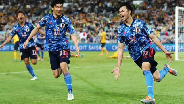 Japan celebrating a goal in World Cup qualifying