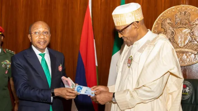 Nigeria's President Muhammadu Buhari unveils new naira notes with Central Bank Governor, Godwin Emefiele