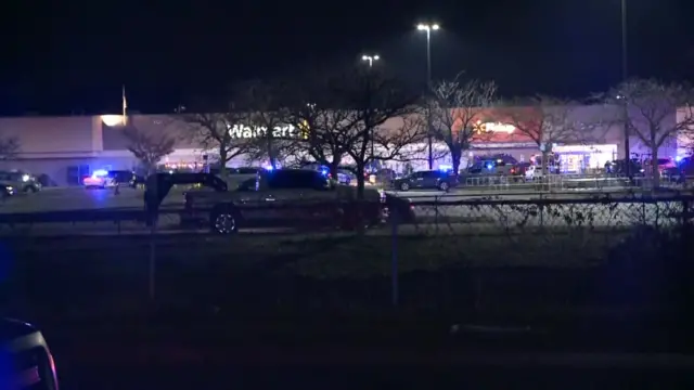 Long shot of exterior of the Walmart store